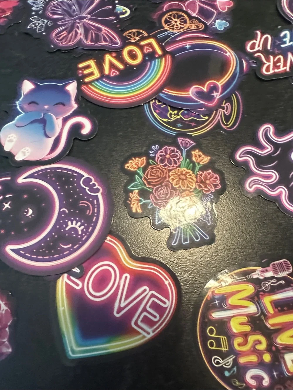 Assorted pack of stickers. Most are 2x2 inches